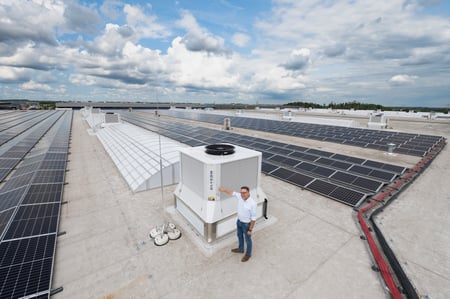 Kor Foekens on the roof next to one of the 19 IntrCooll Plus units.